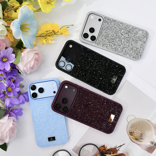 Four rhinestone iPhone cases in silver, black, glacier blue and burgundy on white with flowers and glasses. tbw-rock-all-colors-3
