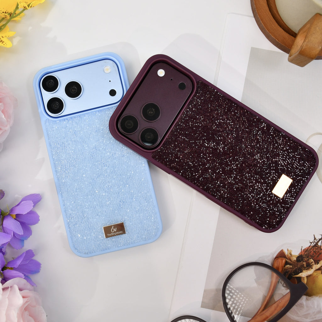 Glacier blue and burgundy rhinestone iPhone cases side by side on white with flowers and glasses. tbw-rock-mix-2